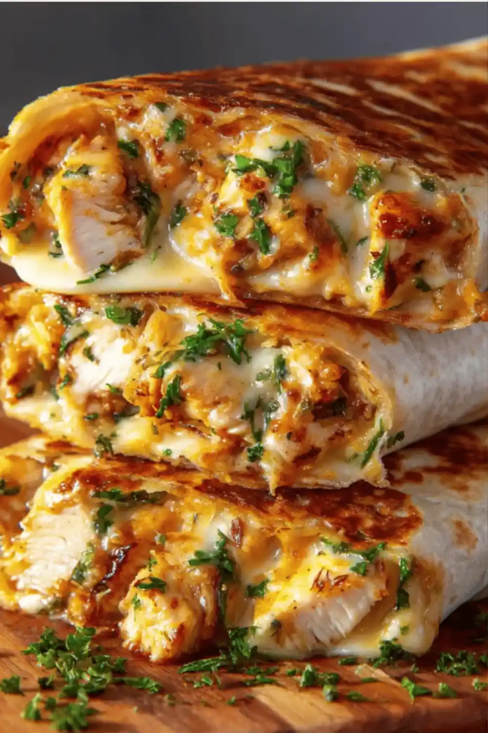 Skillet toasting cheesy garlic chicken wraps