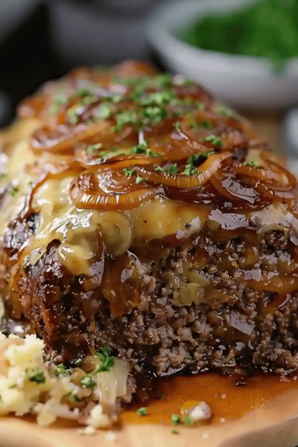 Close-up of melted Swiss cheese on Crockpot French Onion Meatloaf