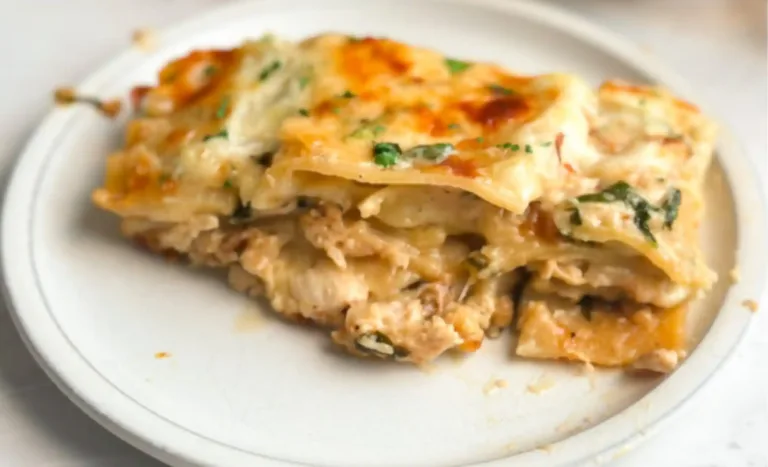 Cheesy Chicken Alfredo Lasagna with spinach Alfredo sauce and golden mozzarella, no ricotta.