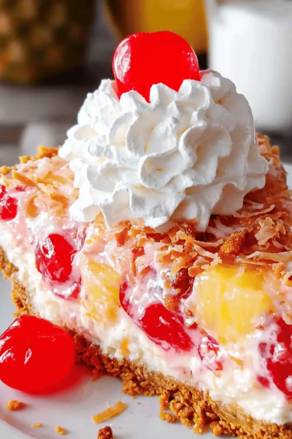 Mouthwatering Millionaire Pie topped with whipped cream, toasted coconut, and pecans, a creamy no-bake dessert filled with pineapple, coconut, and pecans.