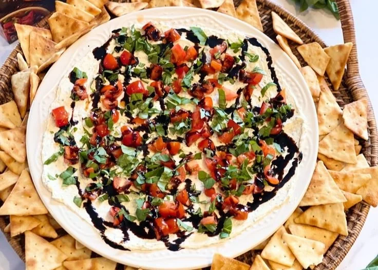 Bowl of Bruschetta Dip served with crispy bread slices and fresh ingredients