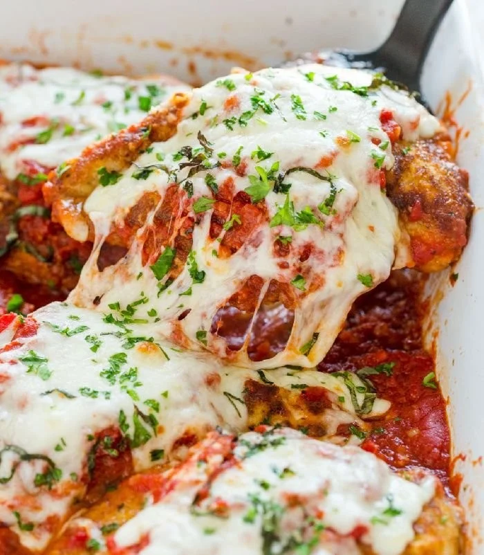 Delicious classic chicken parmesan with marinara sauce and melted cheese