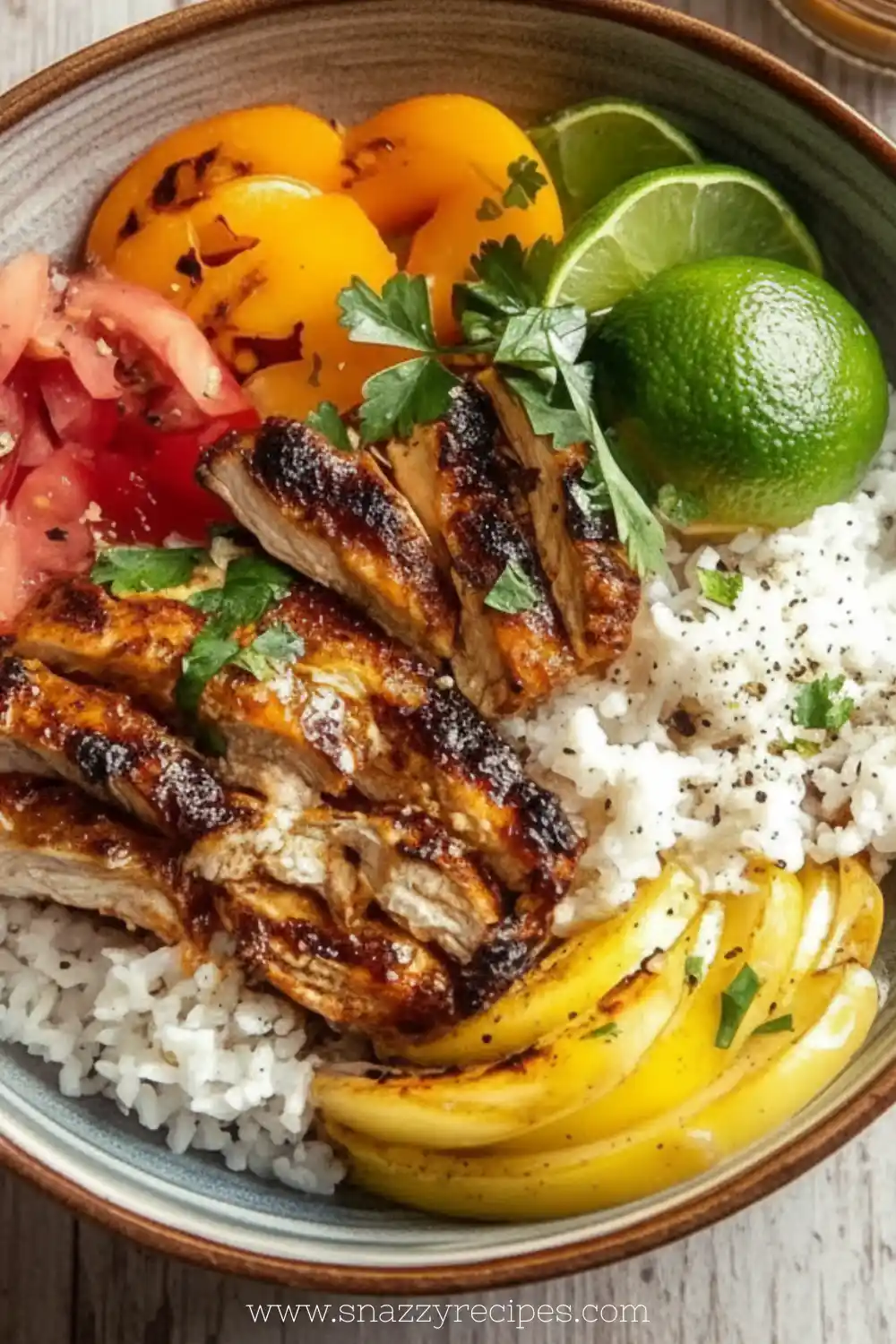 Delicious Honey Lime Chicken and Rice Bowls garnished with fresh herbs and lime slices
