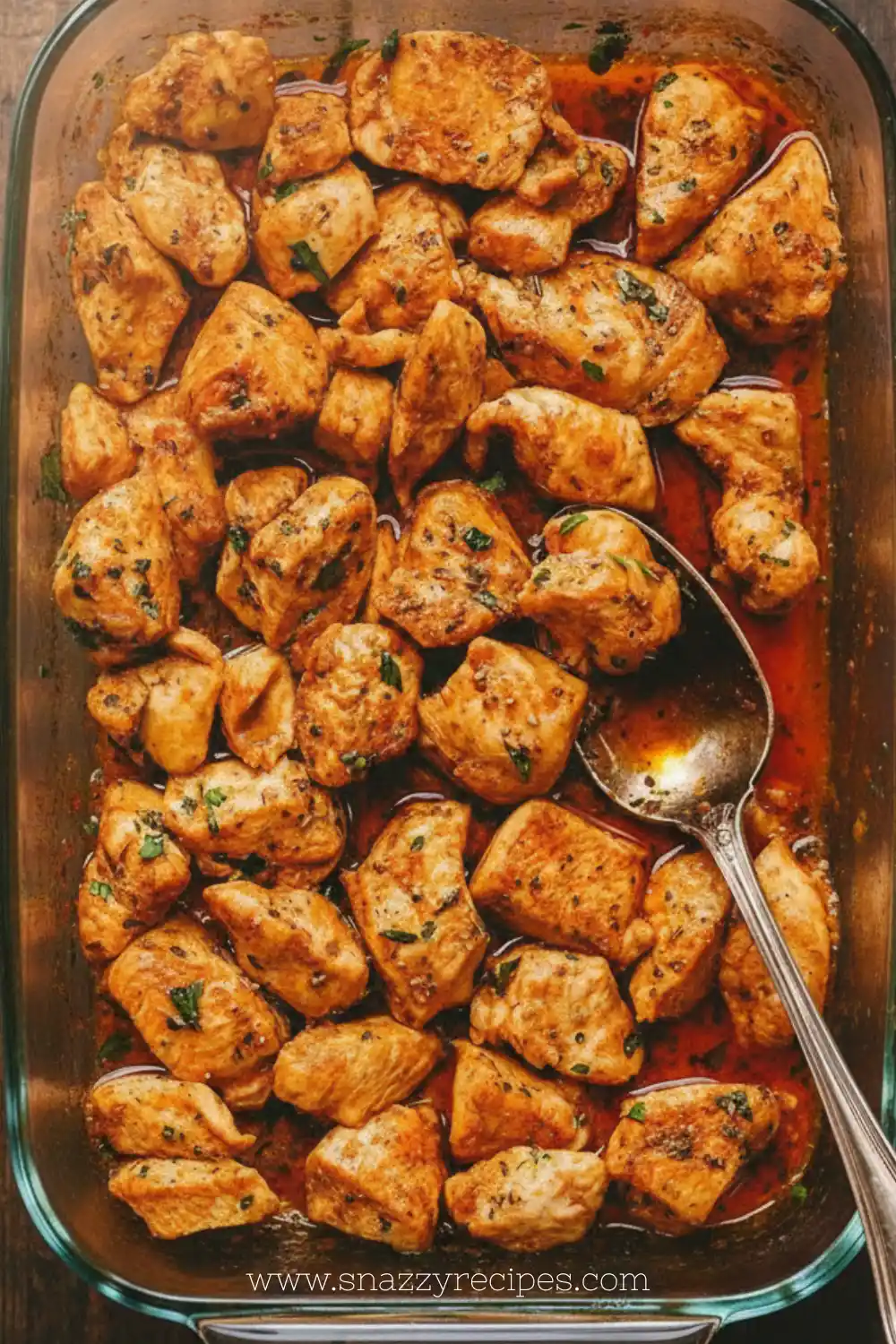 Oven-baked chicken bites served on a plate with dipping sauce