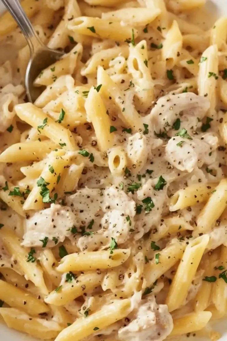 Crockpot Chicken Alfredo dish with creamy sauce and fettuccine pasta