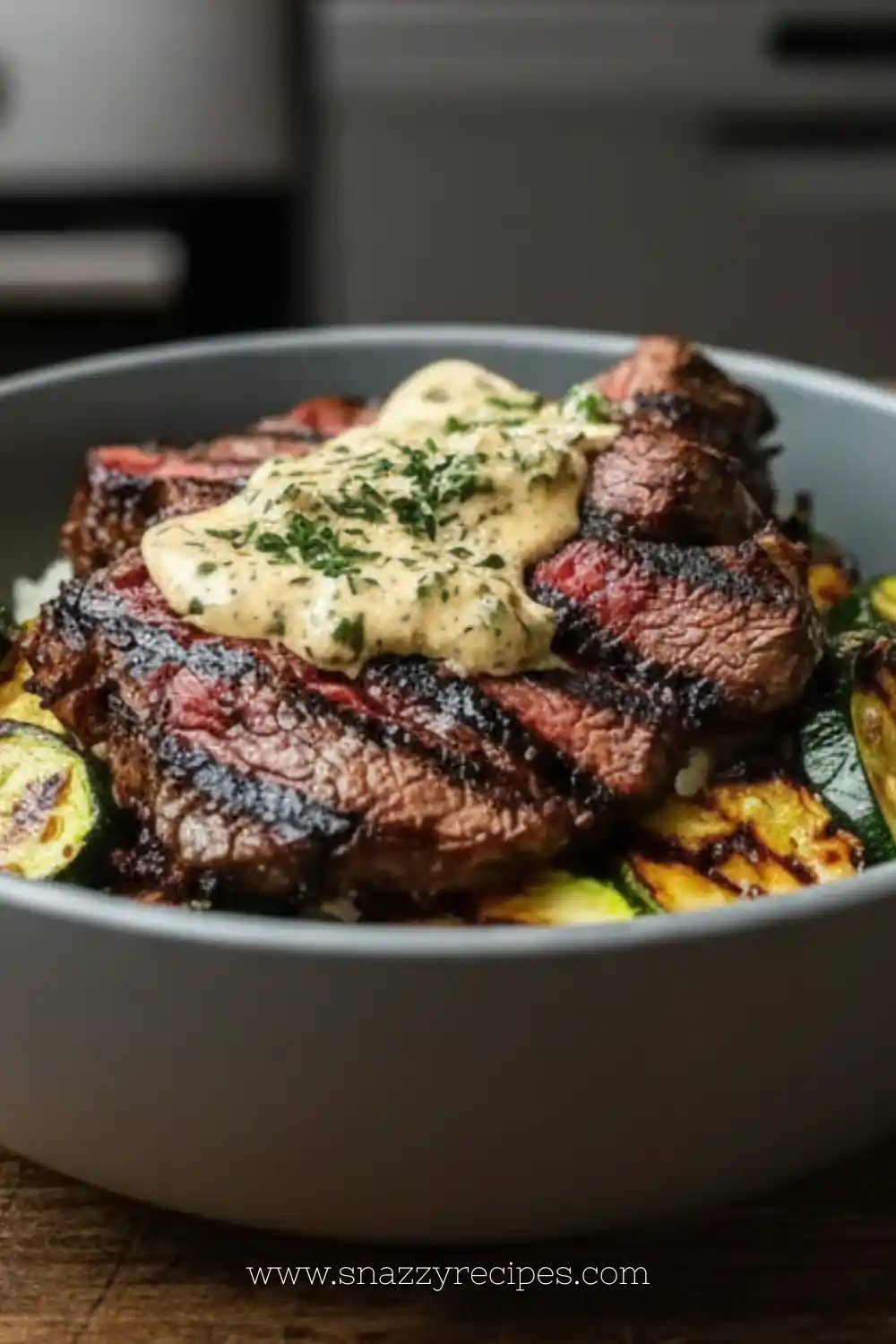 Grilled steak bowl with sauce and grilled zucchini in a white bowl