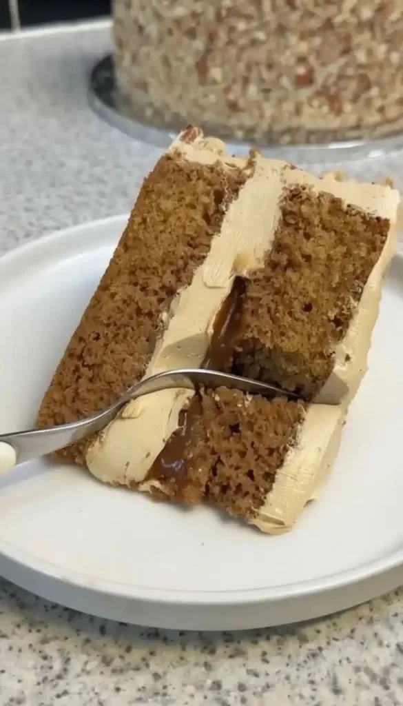 Delicious Caramel Chai Cake topped with caramel drizzle and chai spices