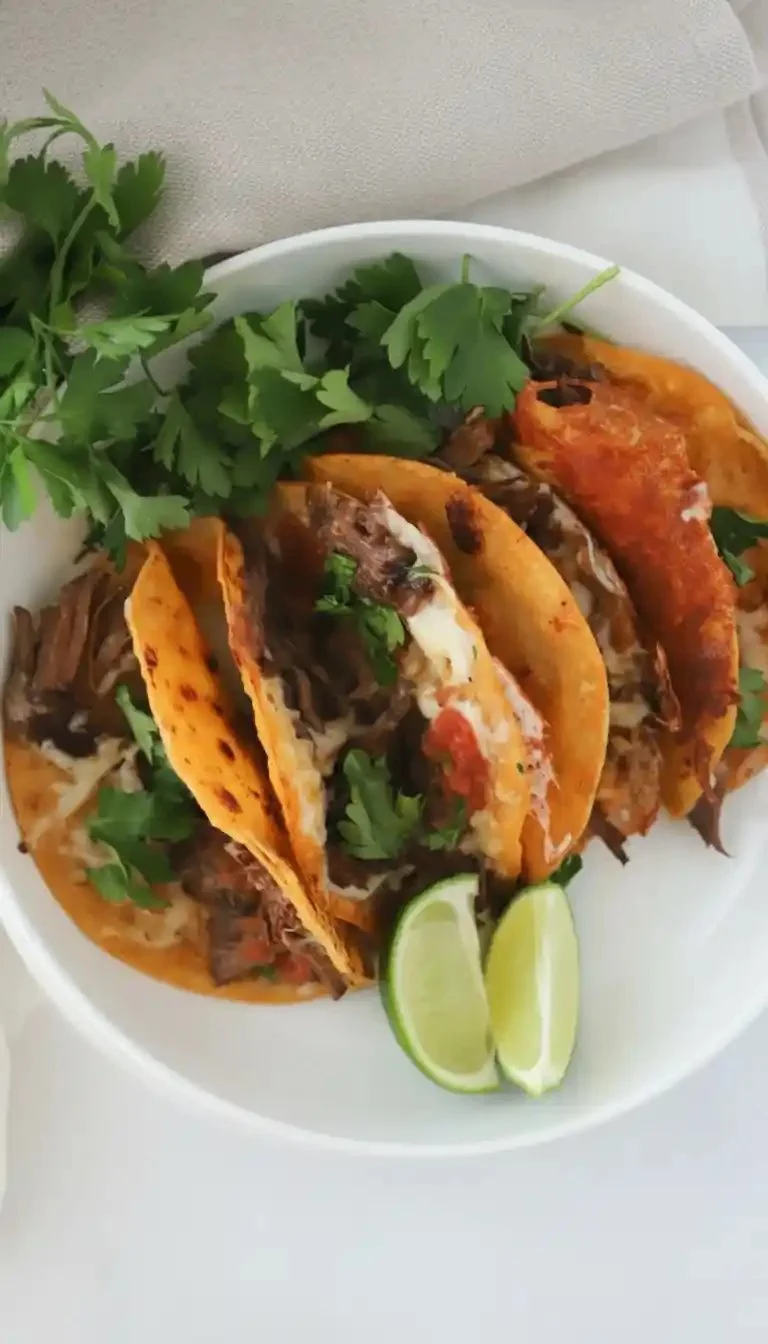 Delicious homemade birria tacos with rich, flavorful broth