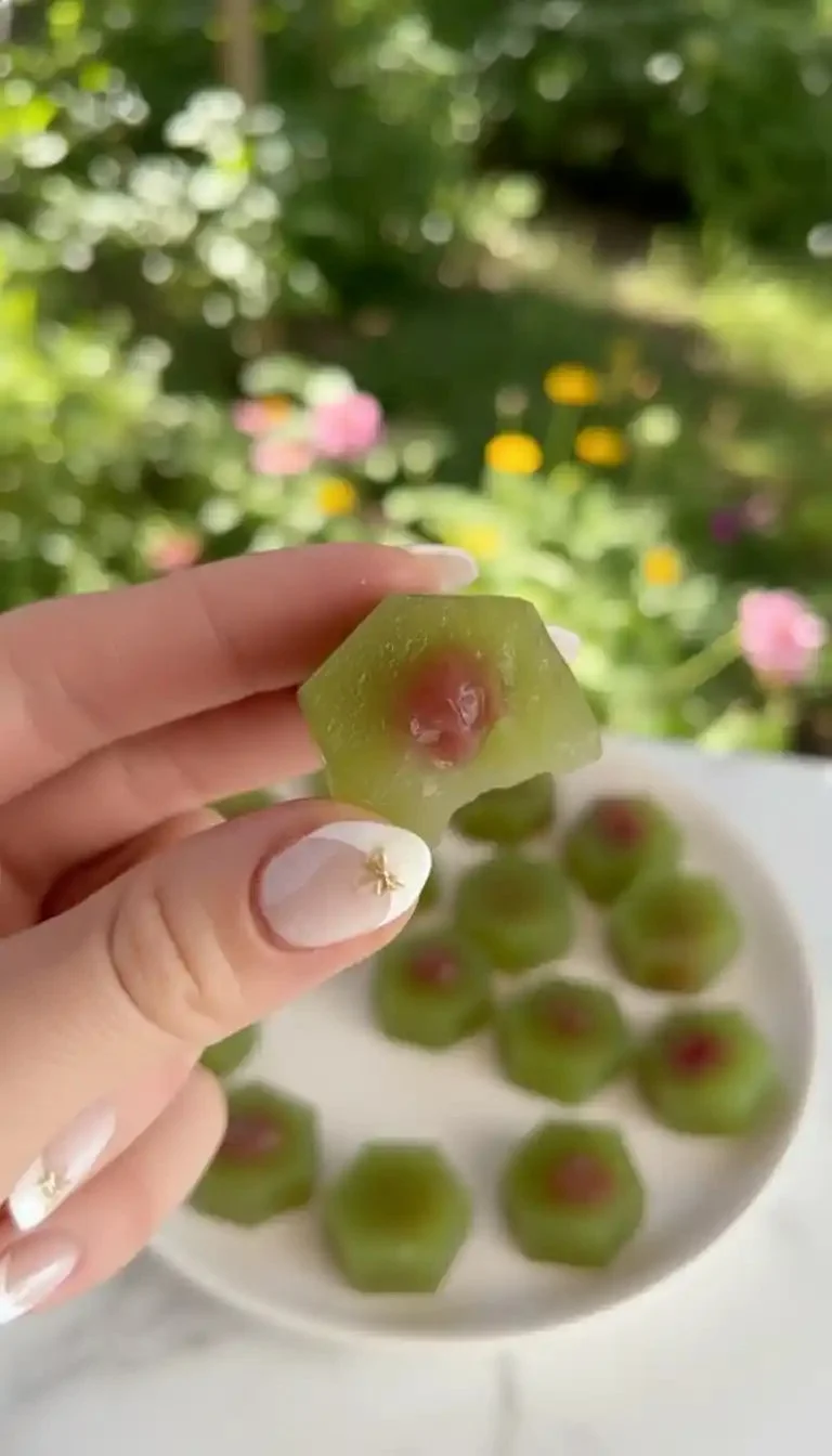 A plate of colorful homemade gushers filled with fruit juice.