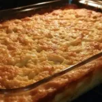 Bowl of creamy homemade mac and cheese topped with breadcrumbs