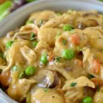 One Pot Gnocchi Chicken Pot Pie in a bowl, garnished with herbs.