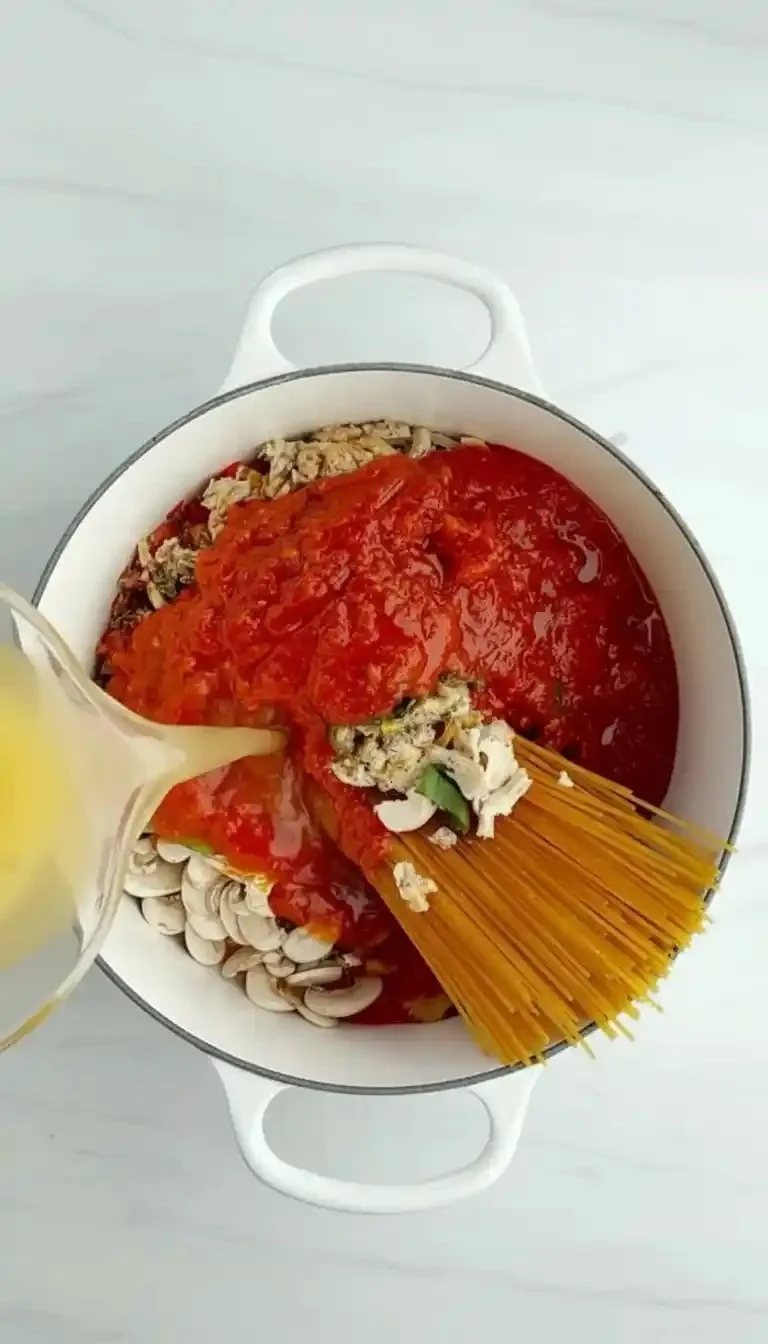 One Pot Healthy Spaghetti meal with fresh ingredients in a pot.