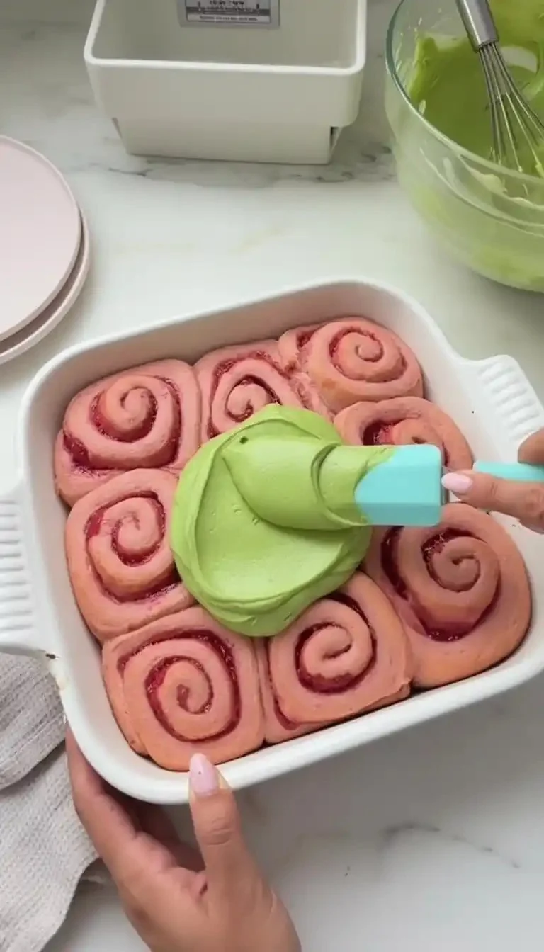 Strawberry Matcha Latte Rolls with fresh strawberries and matcha leaves