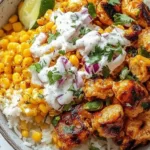 Delicious Street Corn Chicken Rice Bowl with grilled chicken and corn toppings