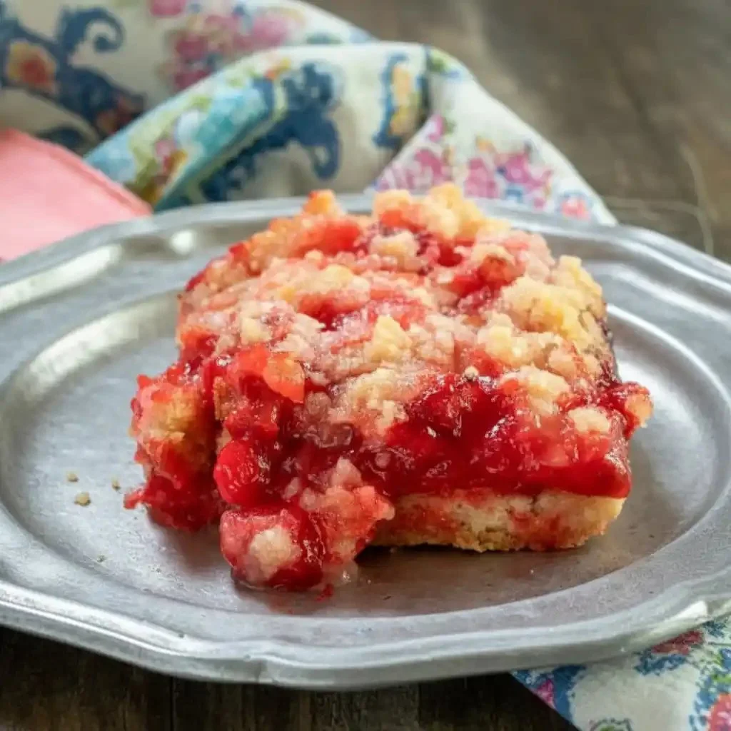 Easy rhubarb dessert featuring cherry jello in a colorful dish
