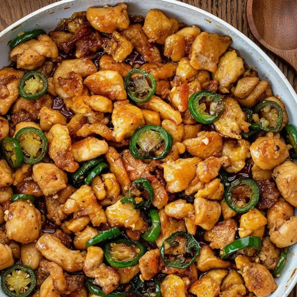 Delicious Jalapeño Chicken garnished with fresh cilantro and sliced jalapeños