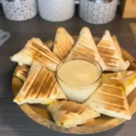 A platter of colorful mini tacos filled with various ingredients.