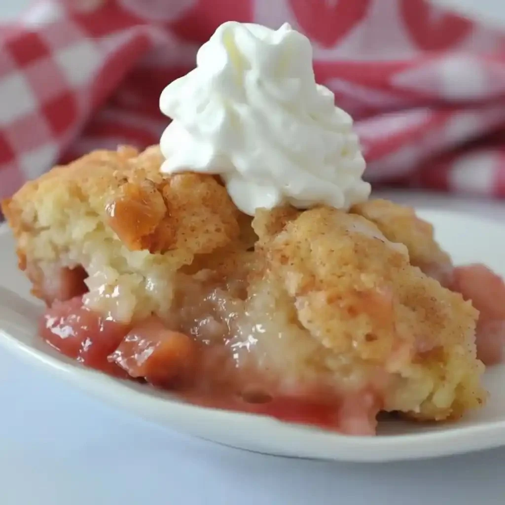 Delicious slice of homemade rhubarb pudding cake on a plate